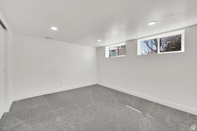 1289 E 31st St S, Ogden, UT 84403 - below grade area featuring a textured ceiling, baseboards, carpet, and recessed lighting