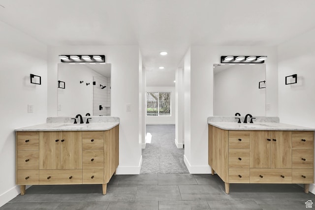 1289 E 31st St S, Ogden, UT 84403 - full bath with a stall shower, two vanities, a sink, and baseboards