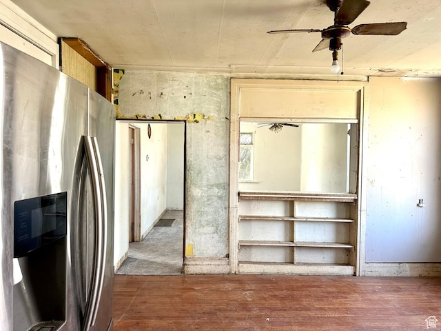 interior space with a ceiling fan and wood finished floors