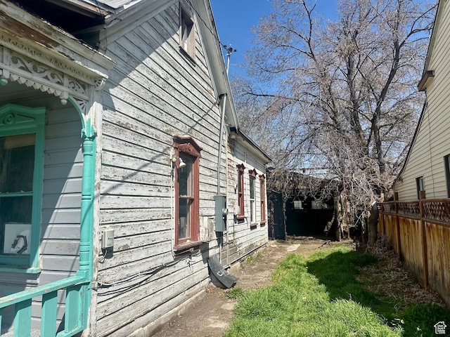 view of property exterior with fence