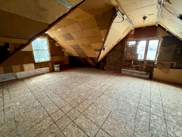 attic featuring a healthy amount of sunlight