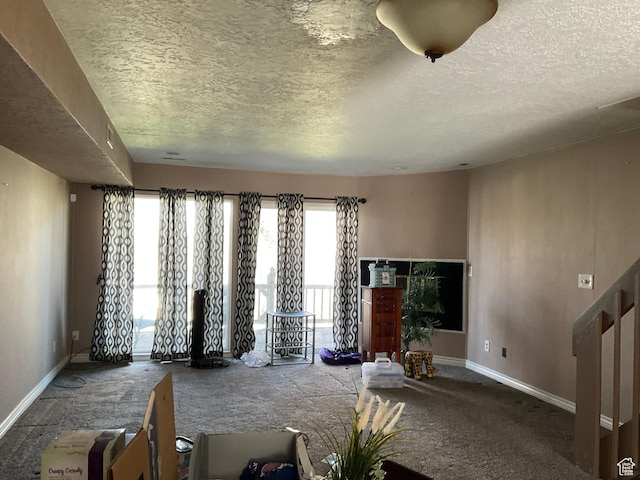 5196 S Gravenstein W, Murray, UT 84123 - unfurnished living room with baseboards and a textured ceiling