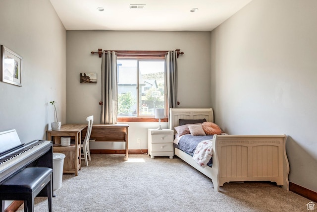bedroom with light colored carpet, baseboards, and visible vents