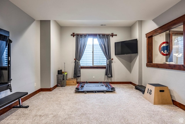 workout room with visible vents, baseboards, and carpet