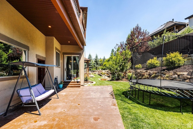 view of patio with entry steps and a trampoline
