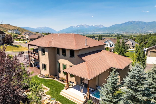 aerial view featuring a mountain view and a residential view