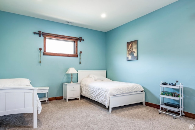 bedroom with visible vents, baseboards, and carpet floors