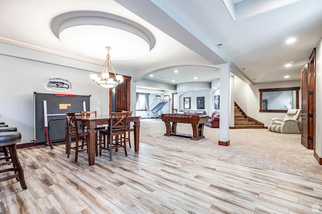 dining room with light wood-style flooring, arched walkways, recessed lighting, stairway, and billiards