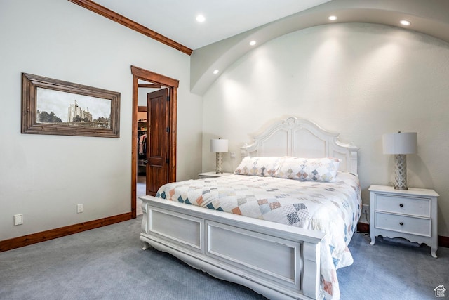 bedroom with baseboards, a closet, a spacious closet, recessed lighting, and carpet