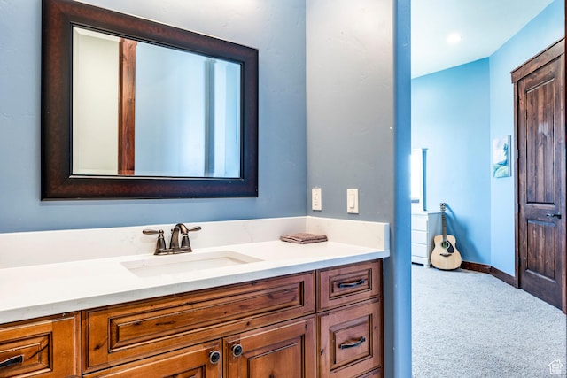 bathroom with baseboards and vanity