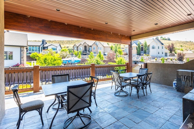 view of patio / terrace featuring a residential view and outdoor dining area