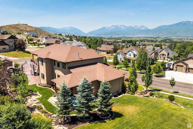 drone / aerial view with a residential view and a mountain view
