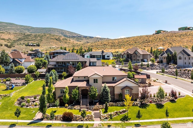 bird's eye view with a mountain view and a residential view