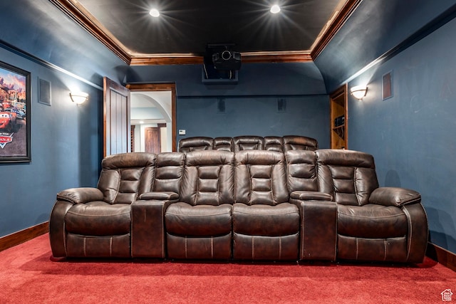 cinema room with ornamental molding, baseboards, and carpet