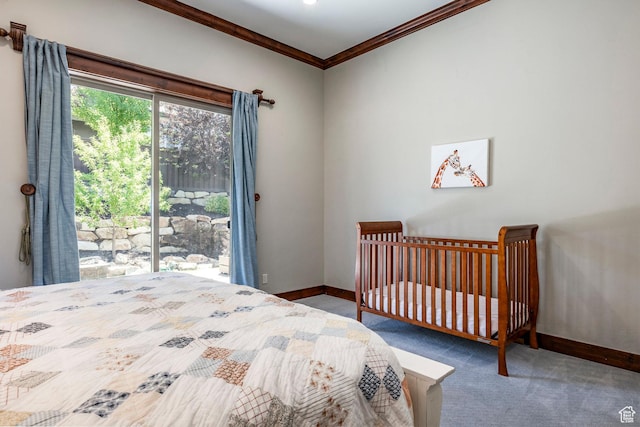 bedroom with carpet flooring, baseboards, and ornamental molding