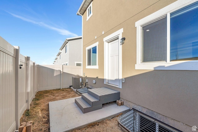 view of patio / terrace with a fenced backyard and central AC unit