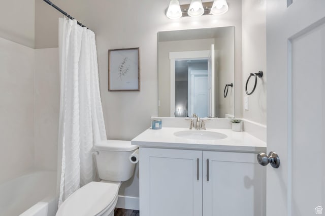 bathroom with shower / tub combo, toilet, and vanity