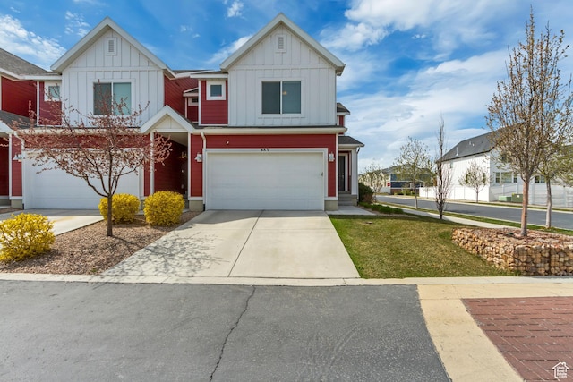 view of front facade with an attached garage, board and batten siding, and concrete driveway