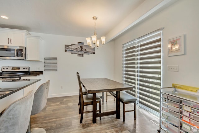 483 S Fox Chase Ln, Saratoga Springs, UT 84045 - dining area with baseboards, recessed lighting, a notable chandelier, and dark wood-style floors