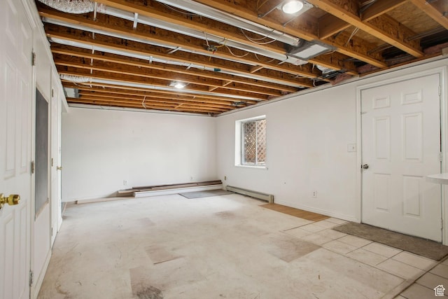 below grade area with a baseboard radiator and baseboard heating