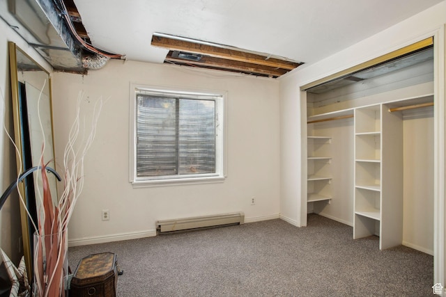 interior space with baseboard heating, baseboards, and carpet floors