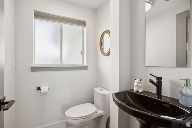 bathroom with a sink and toilet
