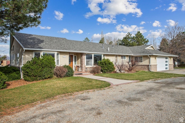 ranch-style house featuring stucco siding, a front lawn, an attached garage, a shingled roof, and concrete driveway