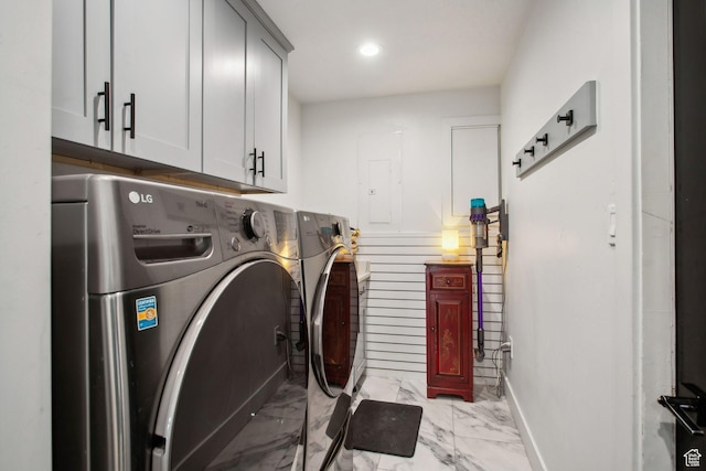 clothes washing area featuring baseboards, recessed lighting, cabinet space, washing machine and clothes dryer, and marble finish floor