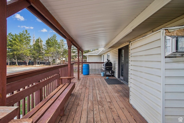wooden deck with grilling area