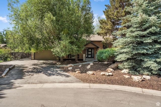 745 Quaking Aspen Ct, Park City, UT 84060 - obstructed view of property with asphalt driveway and an attached garage