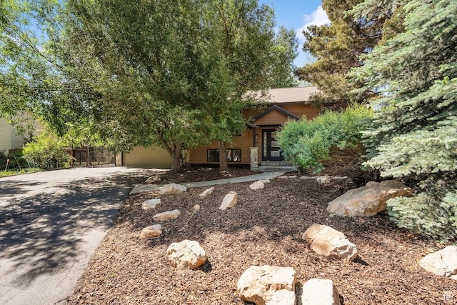 745 Quaking Aspen Ct, Park City, UT 84060 - view of property hidden behind natural elements featuring concrete driveway and a garage