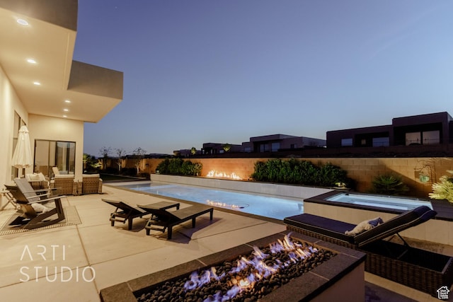 view of pool with a fenced in pool, a patio area, an in ground hot tub, and fence