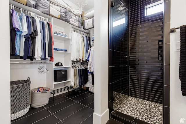 walk in closet featuring tile patterned flooring