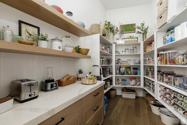 storage area featuring a toaster