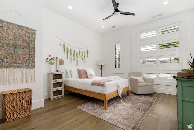bedroom with ceiling fan, visible vents, recessed lighting, hardwood / wood-style floors, and baseboards