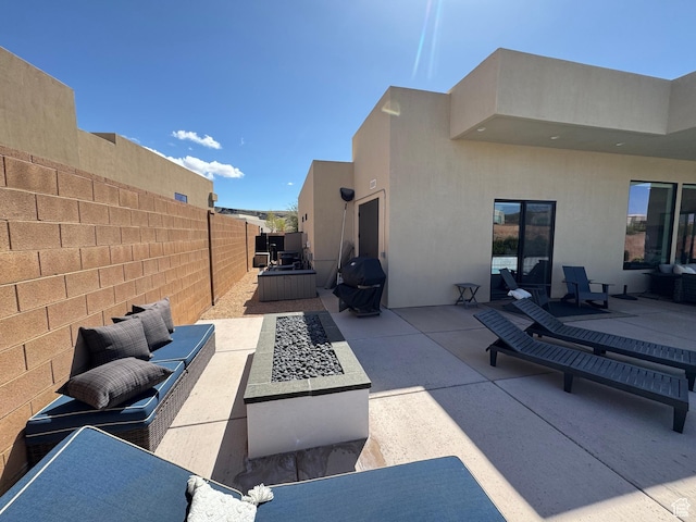 view of patio with a grill and a fenced backyard