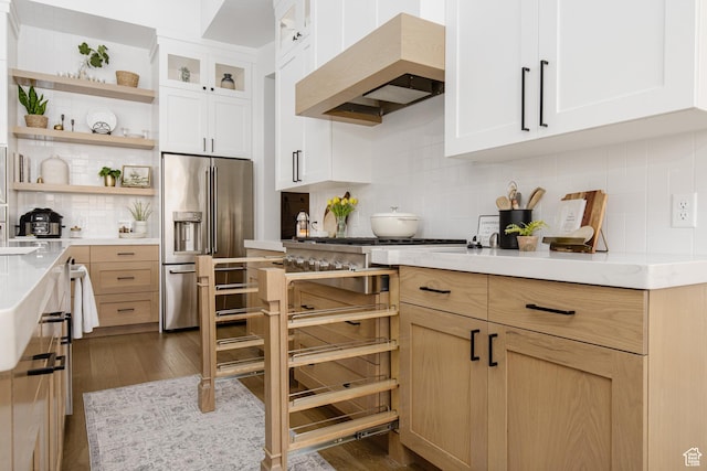 kitchen featuring open shelves, custom exhaust hood, high end refrigerator, decorative backsplash, and dark wood-style floors
