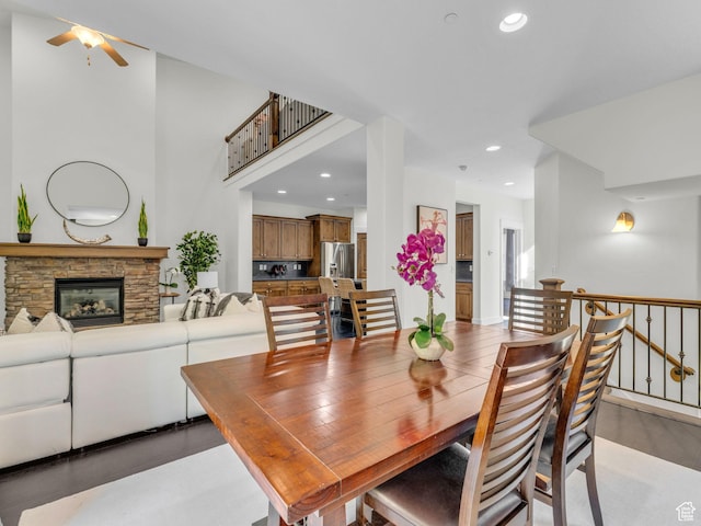 865 W Benjamin Pl, Kamas, UT 84036 - dining space with a ceiling fan, recessed lighting, a stone fireplace, and light wood-style flooring