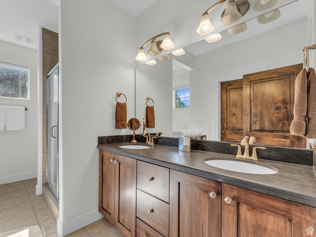 865 W Benjamin Pl, Kamas, UT 84036 - bathroom featuring double vanity, tile patterned flooring, a shower stall, and baseboards