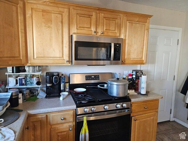 1989 W 1800 N, St George, UT 84770 - kitchen with appliances with stainless steel finishes, light countertops, and tile patterned floors