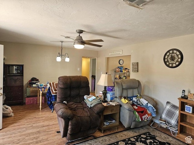 1989 W 1800 N, St George, UT 84770 - living area featuring light wood finished floors, a ceiling fan, and a textured ceiling