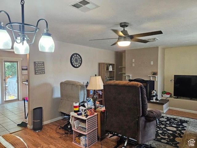 1989 W 1800 N, St George, UT 84770 - living room featuring ceiling fan, wood finished floors, and a textured ceiling