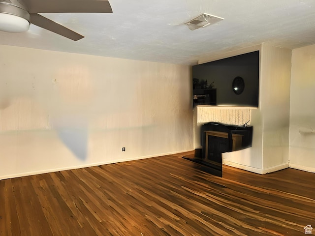 1989 W 1800 N, St George, UT 84770 - unfurnished living room featuring visible vents, baseboards, a ceiling fan, and wood finished floors