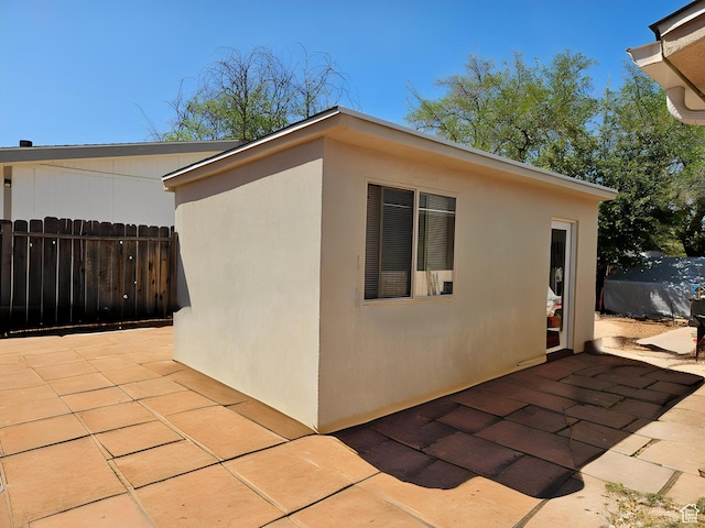 1989 W 1800 N, St George, UT 84770 - view of home's exterior featuring a patio area, stucco siding, and fence