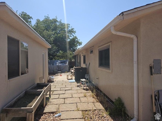 1989 W 1800 N, St George, UT 84770 - view of side of home featuring stucco siding and a patio area