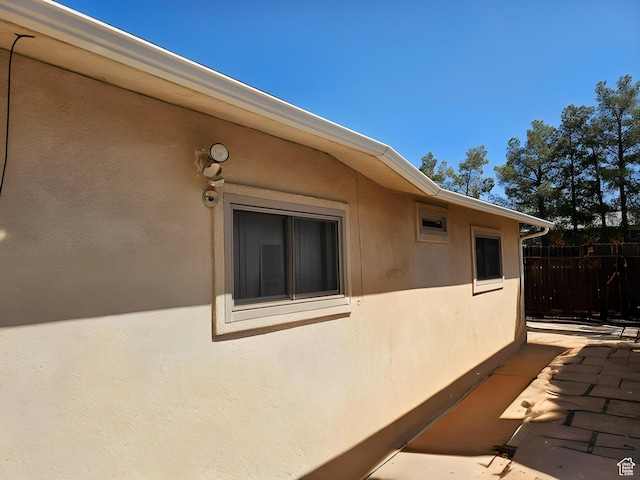 1989 W 1800 N, St George, UT 84770 - view of side of property featuring fence, a patio, and stucco siding