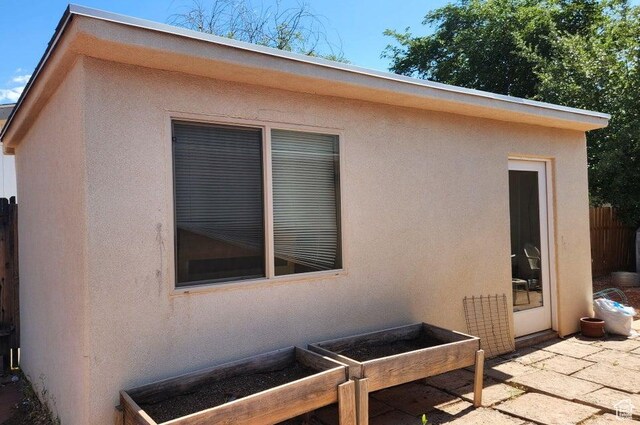 1989 W 1800 N, St George, UT 84770 - view of home's exterior with stucco siding and a patio area