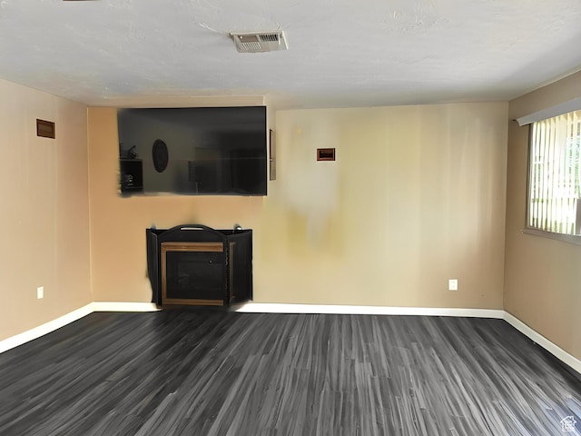 1989 W 1800 N, St George, UT 84770 - unfurnished living room featuring visible vents, baseboards, and dark wood finished floors