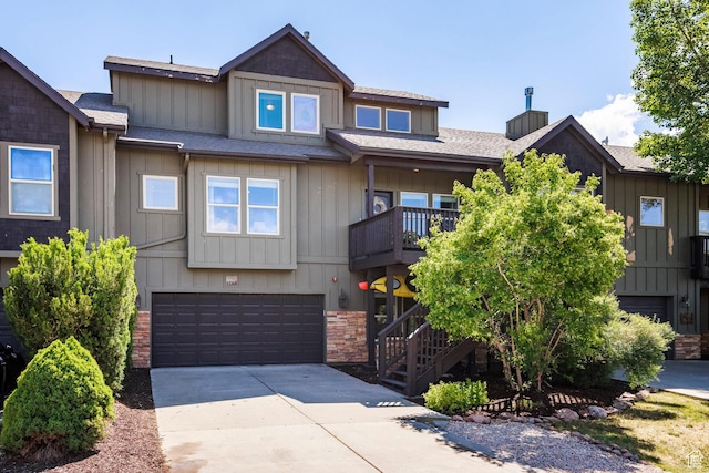 12268 N Ross Creek Dr, Kamas, UT 84036 - view of front facade with a garage, driveway, stairs, a shingled roof, and a chimney