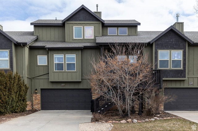 12268 N Ross Creek Dr, Kamas, UT 84036 - view of property with a garage, a shingled roof, driveway, and a chimney